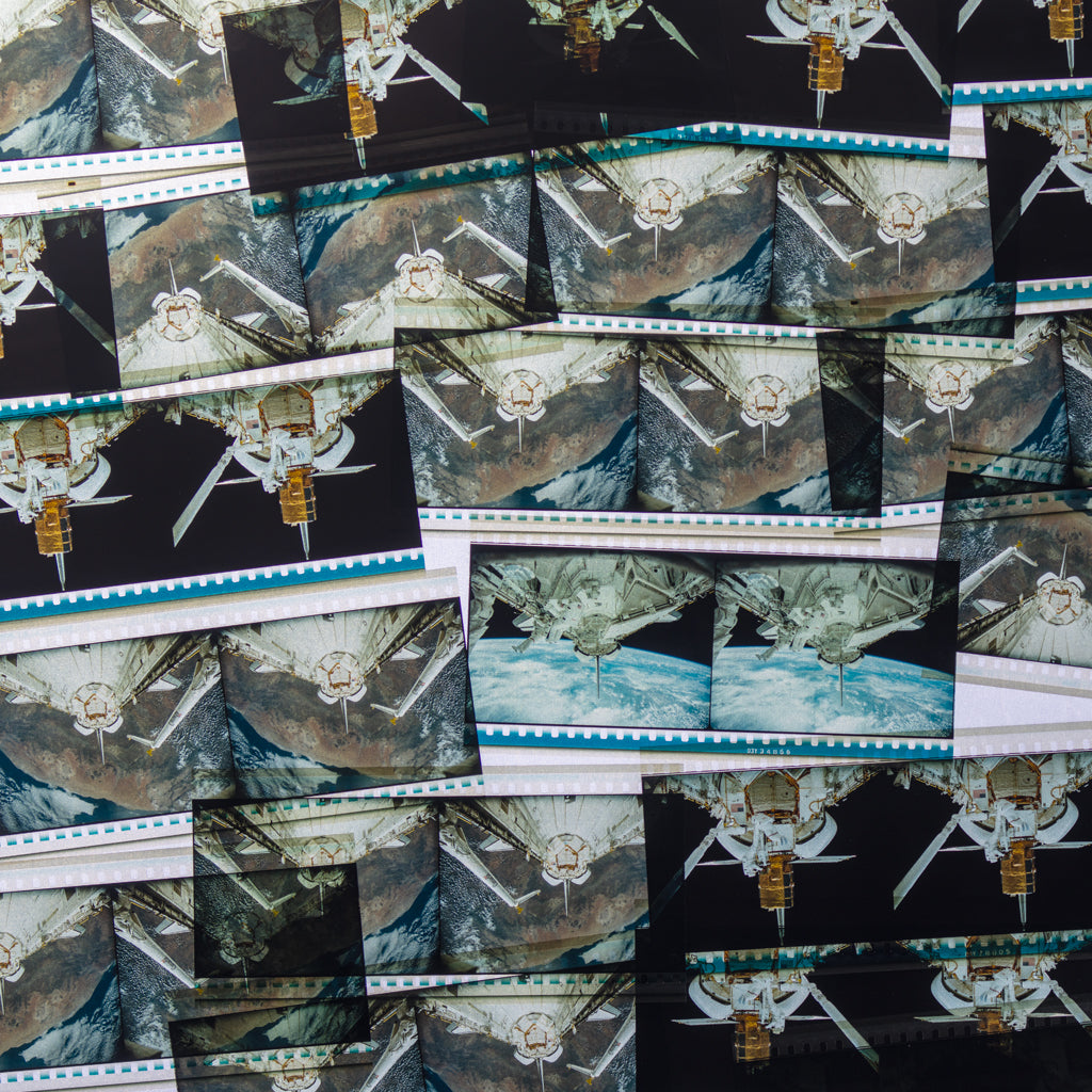 A collection of IMAX filmstrips featuring frames from the first-ever IMAX outer space documentary, The Dream is Alive.