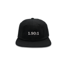 A black hat that has 1.90:1 printed in white on the front. 