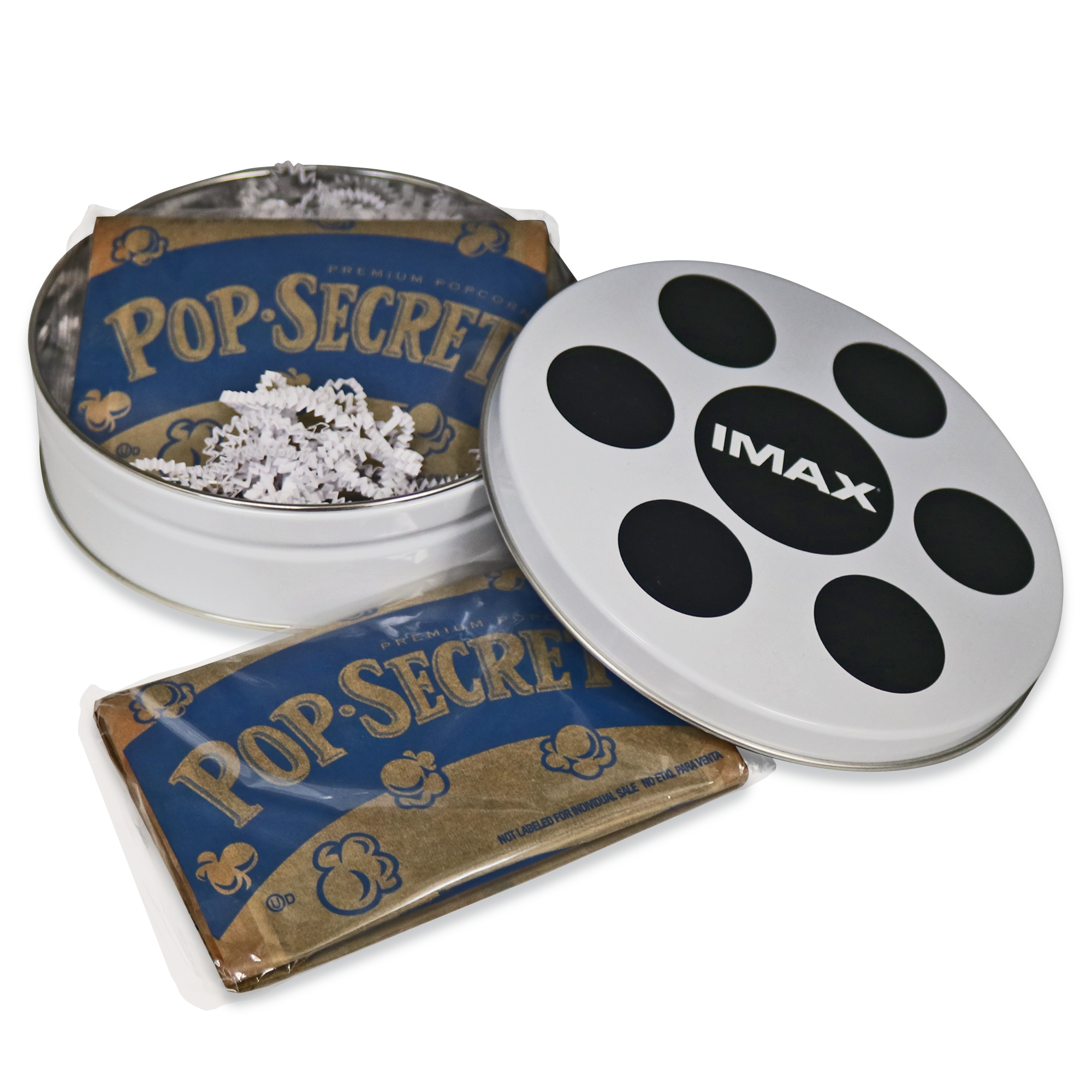 A white popcorn canister designed to resemble a film reel with an IMAX logo on the lid, with two unpopped bags of popcorn inside.