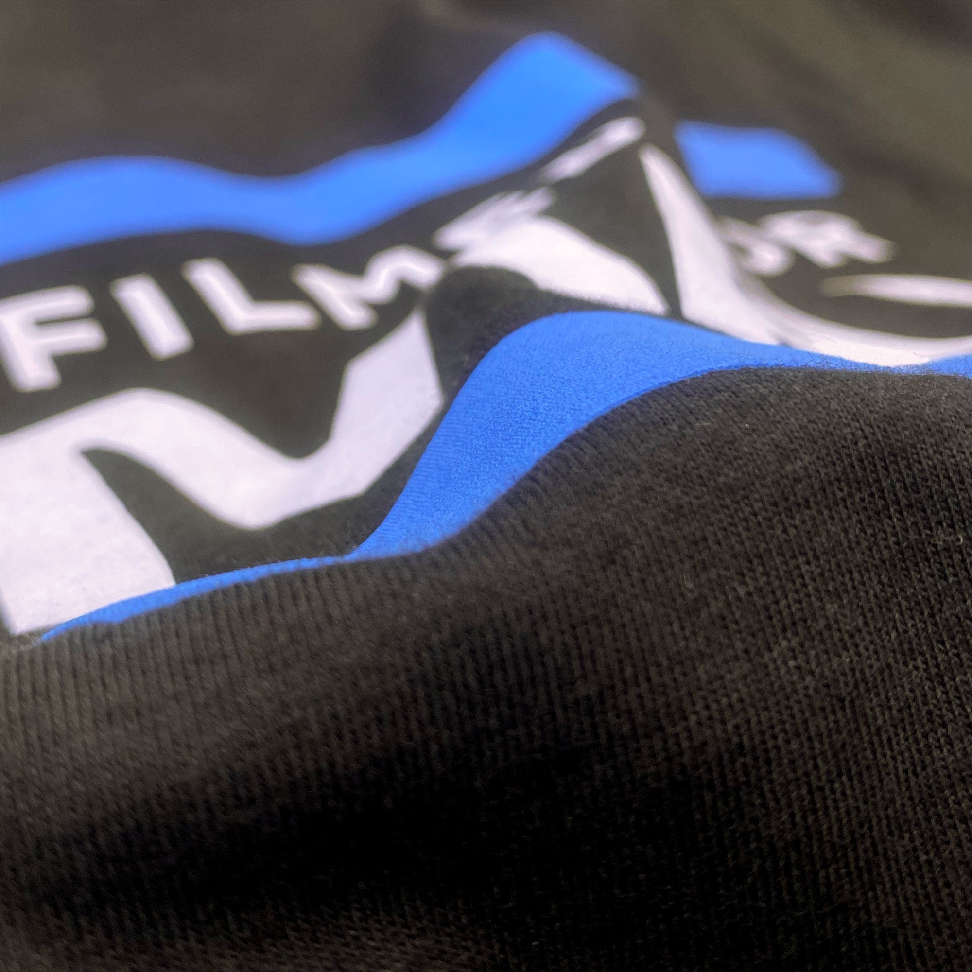 A close up on the high-density blue ink on the T-shirt.  