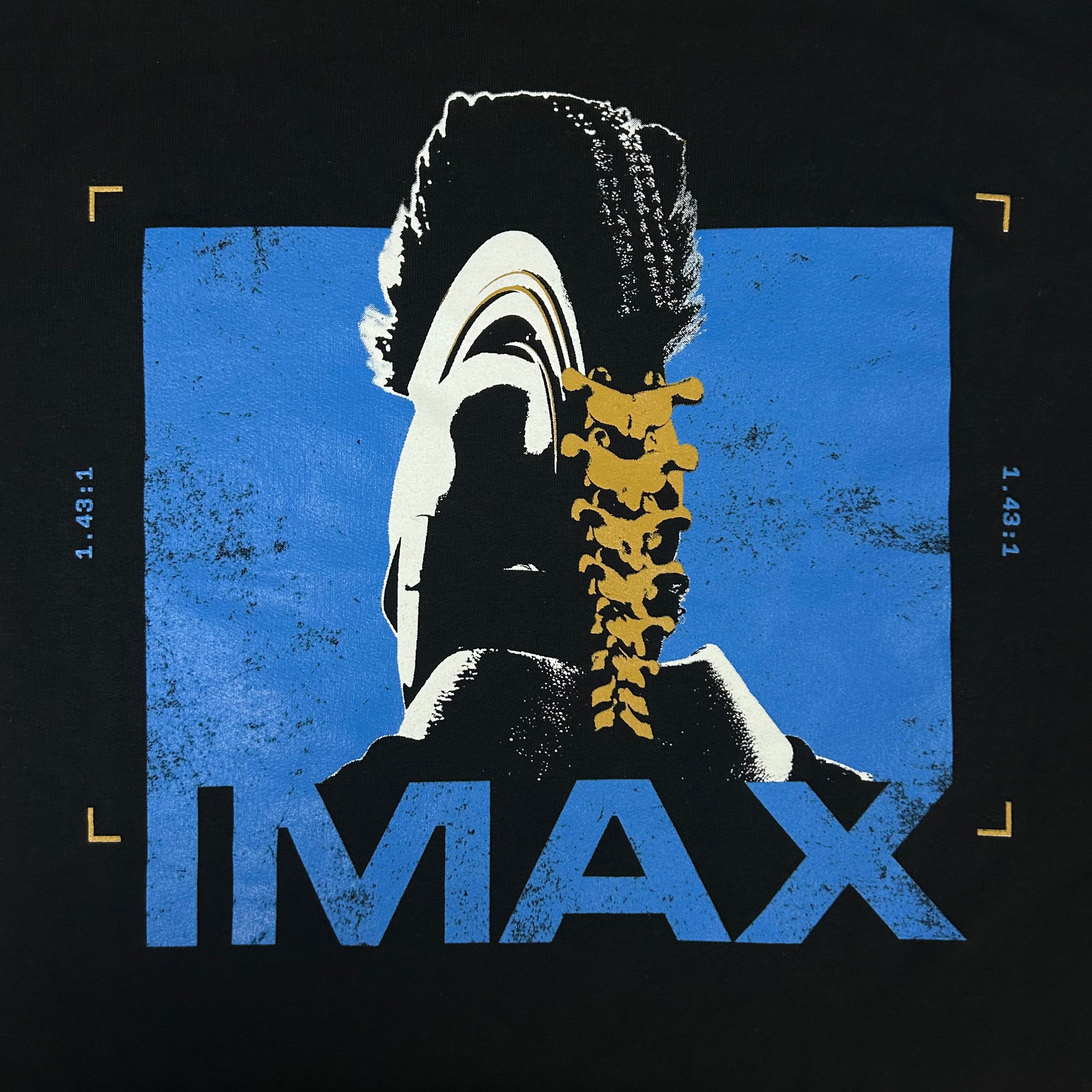 IMAX logo with stylized face and spine design on a black background