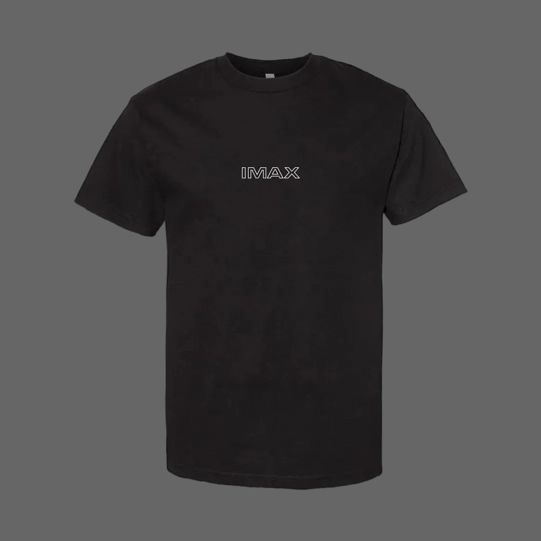Black IMAX T-shirt featuring a small outlined IMAX logo centered on the chest in the front and a collage graphic of the new IMAX 15/65mm camera and lens components on the back