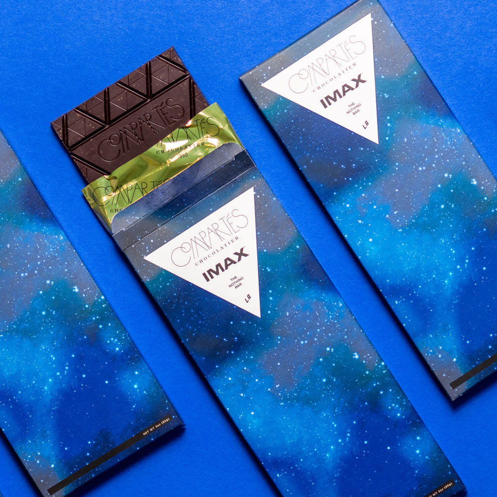Three IMAX and Compartés chocolate bars. 