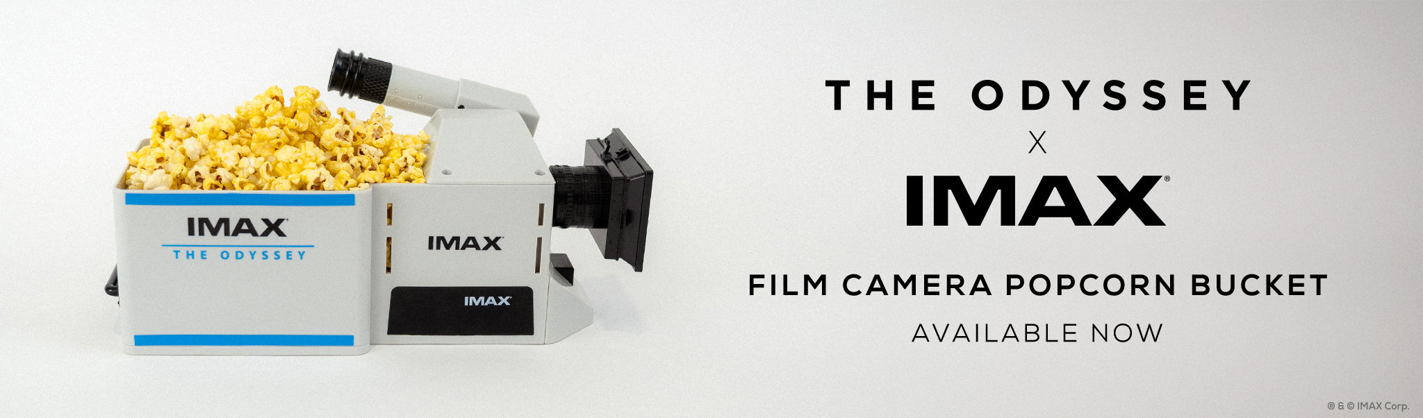 IMAX film camera popcorn bucket with 'The Odyssey' branding on a white background