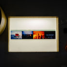 An IMAX 70mm filmstrip featuring 3 scenes from the movie The Odyssey: a red-sailed ship at sea, a group gathered around a fire, figures in warm orange light, and the film title card.