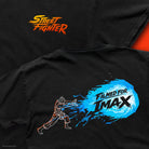 Close up images of the front of the shirt showing the left chest screen print of the  Street Fighter log with the back of the shirt laid over it showing the Haduken fireball with "Filmed For IMAX" in the fireball. 