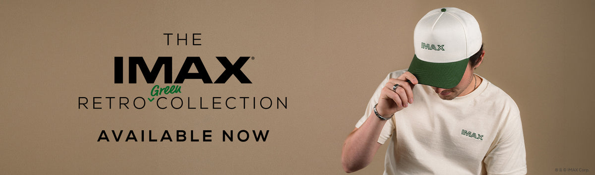 A promotional banner for IMAX Retro Collection featuring a model wearing a white and green IMAX cap and a white t-shirt against a solid beige background, with text reading 'THE IMAX RETRO COLLECTION AVAILABLE NOW'.
