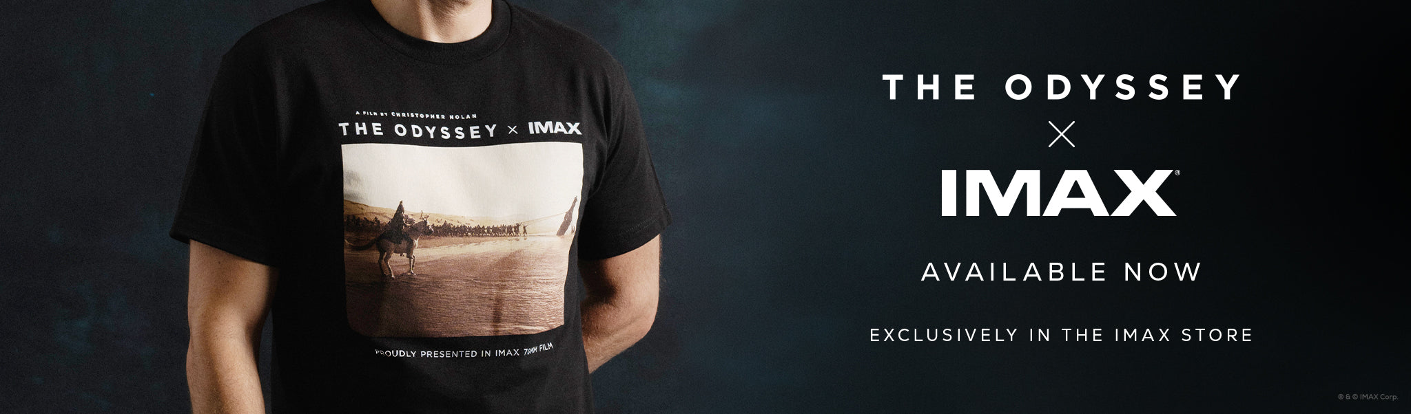 Person wearing a black t-shirt with 'The Odyssey' graphic, promotional text for 'The Odyssey x IMAX' collaboration.