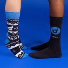 Two people wearing IMAX-branded socks.