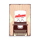Poster artwork depicting a dark typewriter with a sheet of paper that reads The Shining Experience It In IMAX in red and black text. The background repeats the phrase ‘ALL WORK AND NO IMAX MAKES JACK A DULL BOY’ in red text against an off-white background and black poster border.  