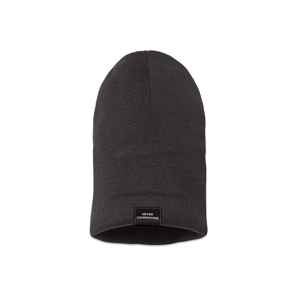 Uncuffed black beanie with "Never Compromise" on a black tag on the edge of the beanie